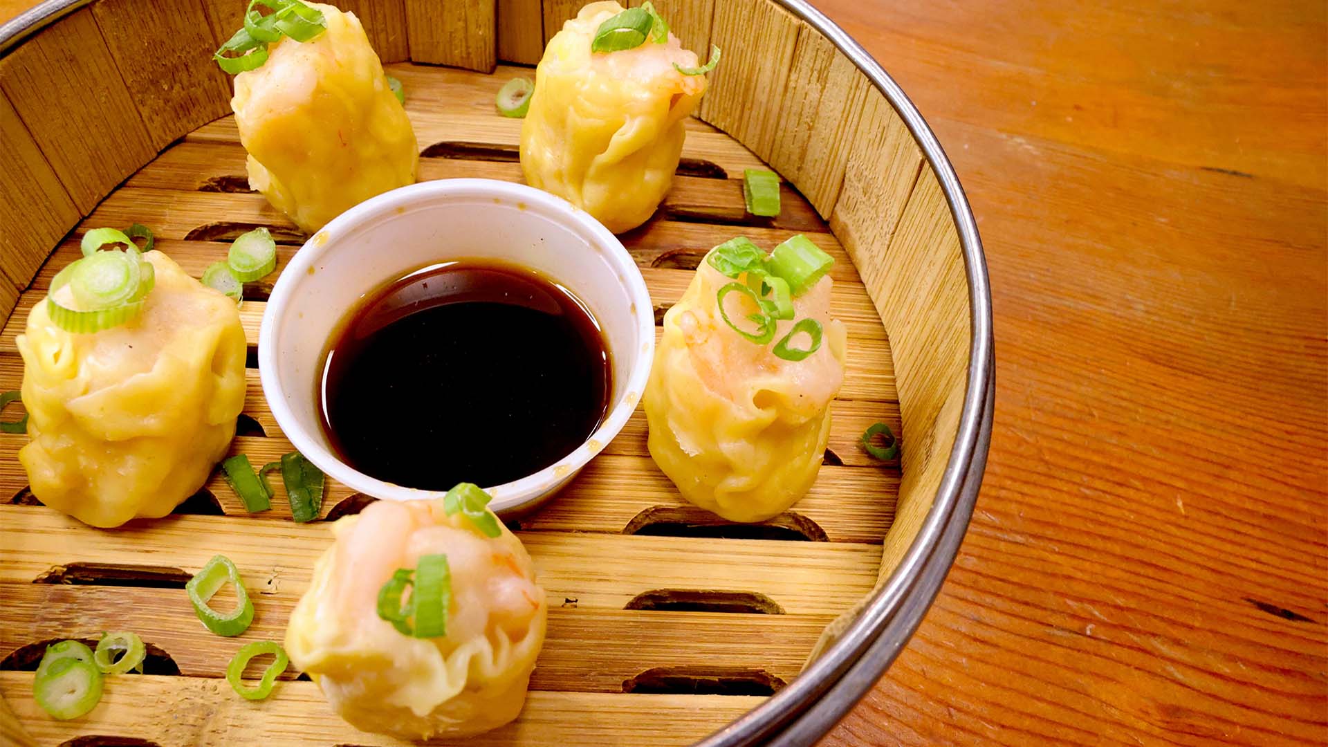 Plump steamed shrimp shumai with soy dipping sauce at Dumpling X, an Asian Fusion Restaurant in Deerfield Beach